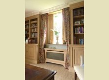 Pine study with bookcases, matching radiator covers and window shutters